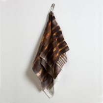 Drape #1, 2023 Rust dyed damask napkins, vitreous enamel on copper, found laundry pin 38 x 16 x 3' (approx.)