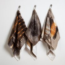 Drape, 2023 Rust dyed damask napkins, vitreous enamel on copper, found laundry pin 38 x 16 x 3' each (approx.)