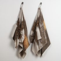 Twisted, 2025 Rust and tannin-dyed damask napkins, buttons, steel laundry pin 36 x 24 x 6” (each in the pair)